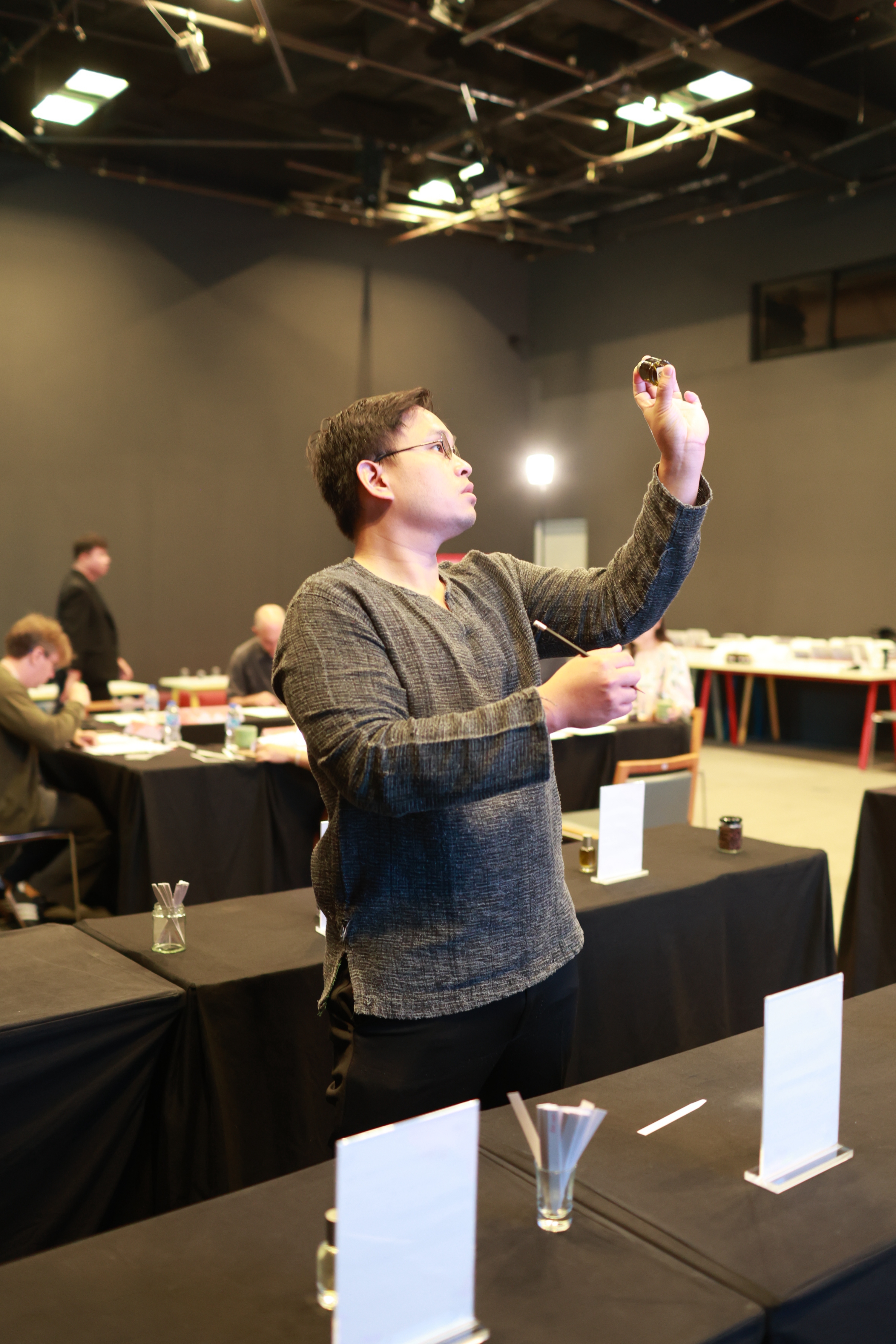 Kenji Chanthapoon evaluating a fragrance material during perfumery study