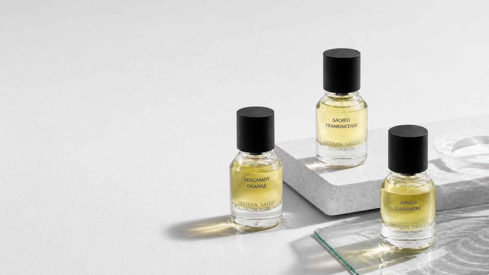 Artisan Valley fragrances in a neutral editorial studio setting.