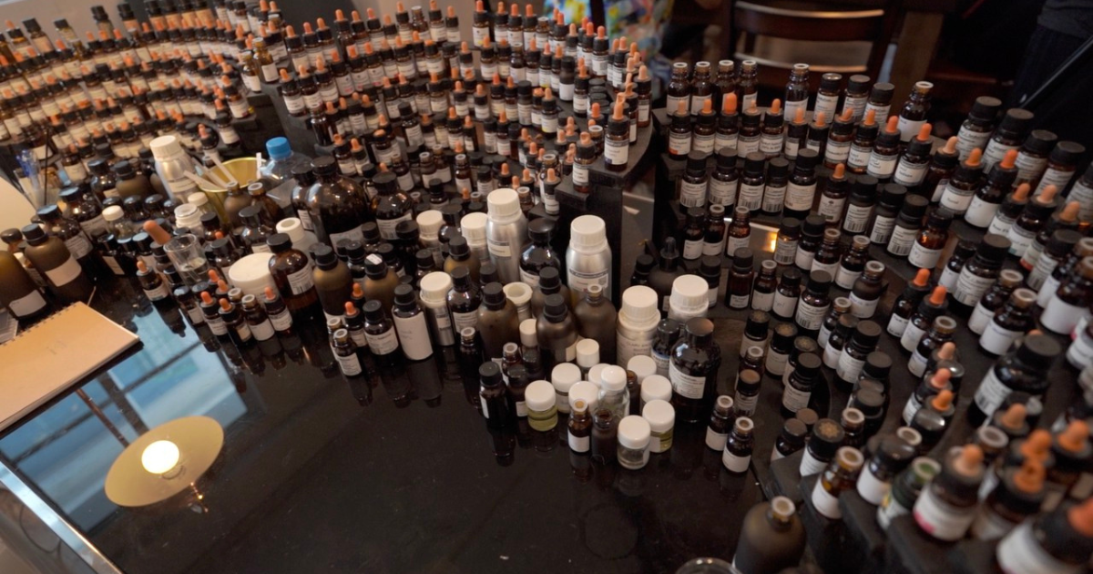 A large working collection of fragrance materials arranged for comparison